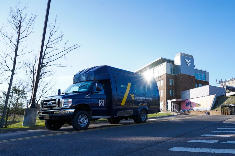 The blue accessibility van traveling near Evansdale Crossing